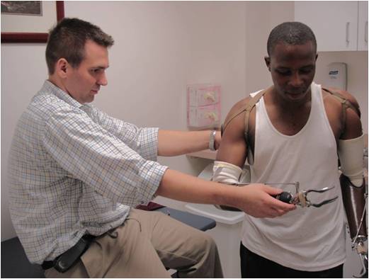 Photo: Frederick being fitted for prosthetics