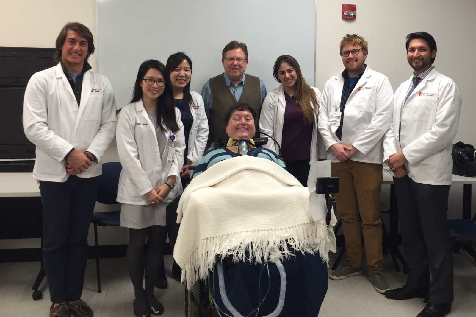 Photo: Brooke Hope with medical students and Stephen Post
